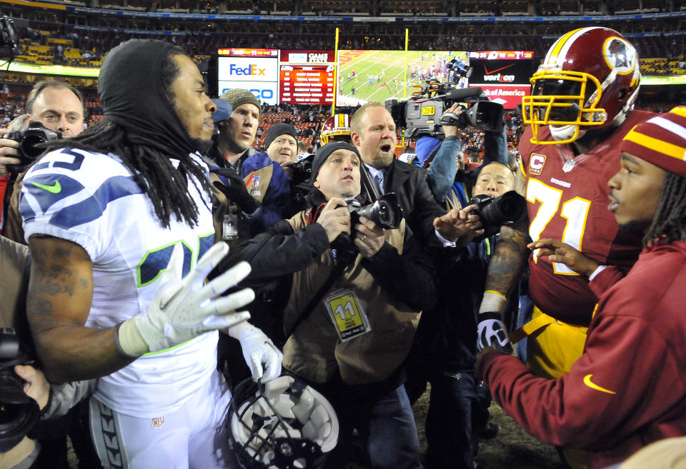 Niners cornerback Richard Sherman (25) and new left tackle Trent Williams had a heated exchange in a playoff game seven years ago. Now they're teammates. (Mark Gail/Tribune News Service via Getty Images)