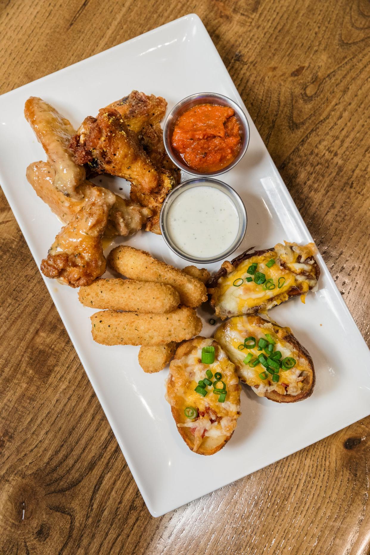 A selection of shareables served at the new ESPN BET sportsbook retail spot inside Hollywood Casino at Greektown.