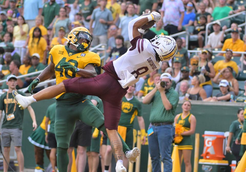 Texas State running back Donerio Davenport goes up for a touchdown catch during the first half of Saturday night's 42-31 win over Baylor at McLane Stadium in Waco. It was the Bobcats' first win over a Power Five program.