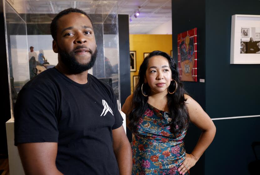 COMPTON-CA-SEPTEMBER 18, 2023: Mark Byrd, left, and Abigail Lopez-Byrd, founders of Compton Art & History Museum in Compton, California, are photographed on Monday, September 18, 2023, where the current exhibition on display is "Sounds of the City". The couple is focusing their efforts on getting the museum off the ground and aims to create a place of community. (Christina House / Los Angeles Times)