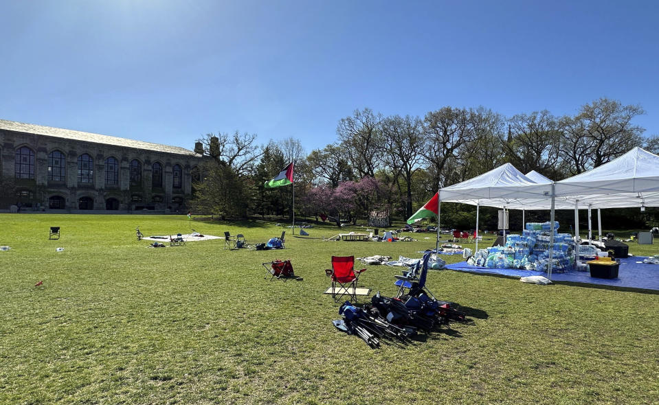 Tents, flags and other supplies remain at Deering Meadow on Northwestern University's campus in Evanston, Ill. on Tuesday, April 30, 2024, a day after the university and protest organizers announced an agreement which largely ended anti-war demonstrations that have lasted days. (AP Photo/Melissa Perez Winder)