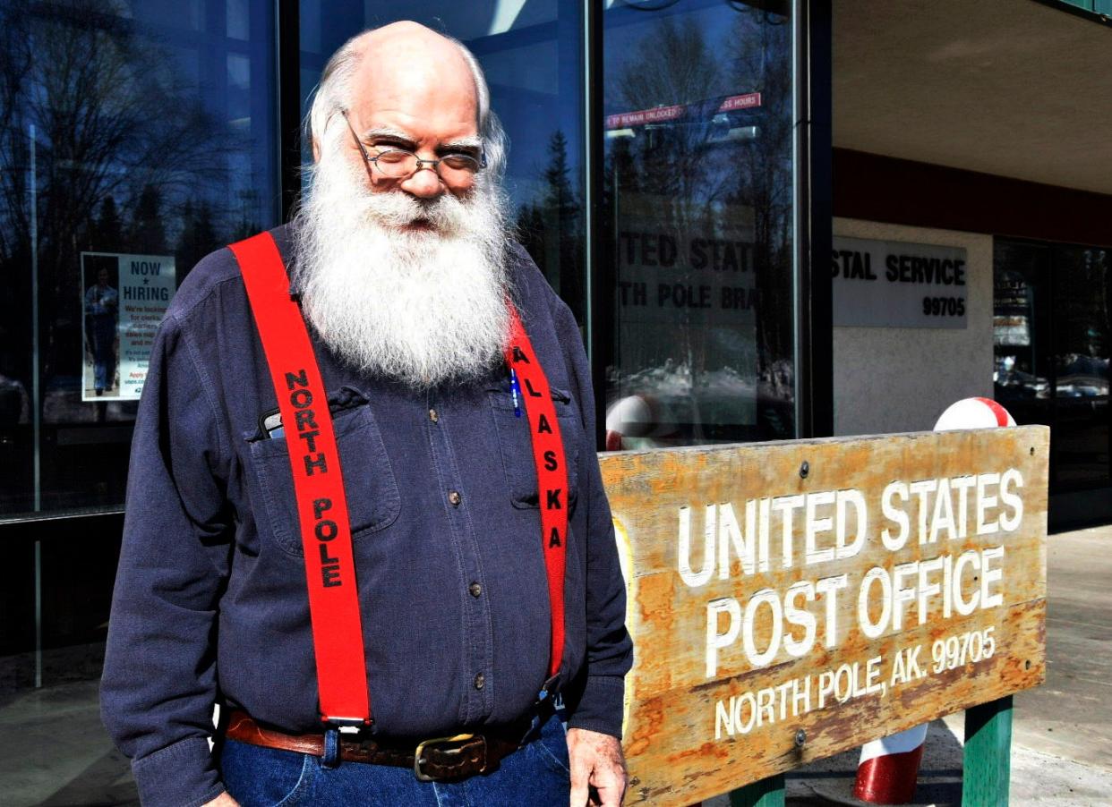 Santa Claus stands in front of the North Pole post office (Anchorage Daily News)