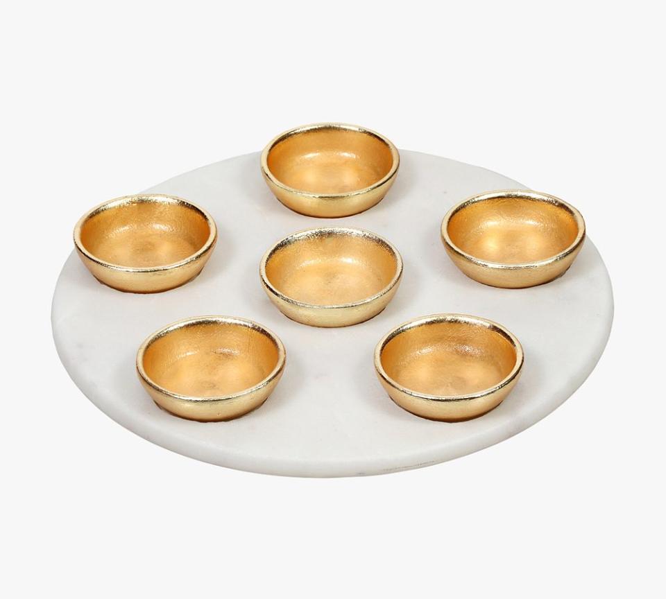 <p><a href="https://go.redirectingat.com?id=74968X1596630&url=https%3A%2F%2Fwww.potterybarn.com%2Fproducts%2Fmarble-seder-plate-set-gold-bowls-mp%2F&sref=https%3A%2F%2Fwww.elledecor.com%2Fshopping%2Fhome-accessories%2Fg60050605%2Fseder-plates-for-passover%2F" rel="nofollow noopener" target="_blank" data-ylk="slk:Shop Now;elm:context_link;itc:0;sec:content-canvas" class="link ">Shop Now</a></p><p>Marble Seder Plate Set with Gold Bowls</p><p>potterybarn.com</p><p>$129.00</p><span class="copyright">Courtesy of Pottery Barn </span>