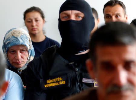 Fattoum Hassan (L), a Syrian migrant who was put on trial for illegal border crossing, listens to the court sentencing in Szeged, Hungary, July 1, 2016. REUTERS/Laszlo Balogh