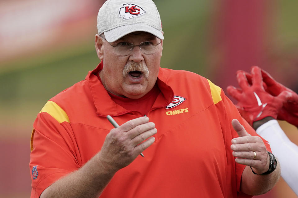 Kansas City Chiefs head coach Andy Reid talks to players during NFL football training camp Monday, Aug. 15, 2022, in St. Joseph, Mo. (AP Photo/Charlie Riedel)
