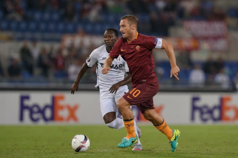 AS Roma's forward from Italy Francesco Totti (R) fights for the ball with Astra's midfielder from Senegal Boubacar Mansaly during the UEFA Europa League football match AS Roma vs Astra at Rome's Olympic stadium, on September 29, 2016