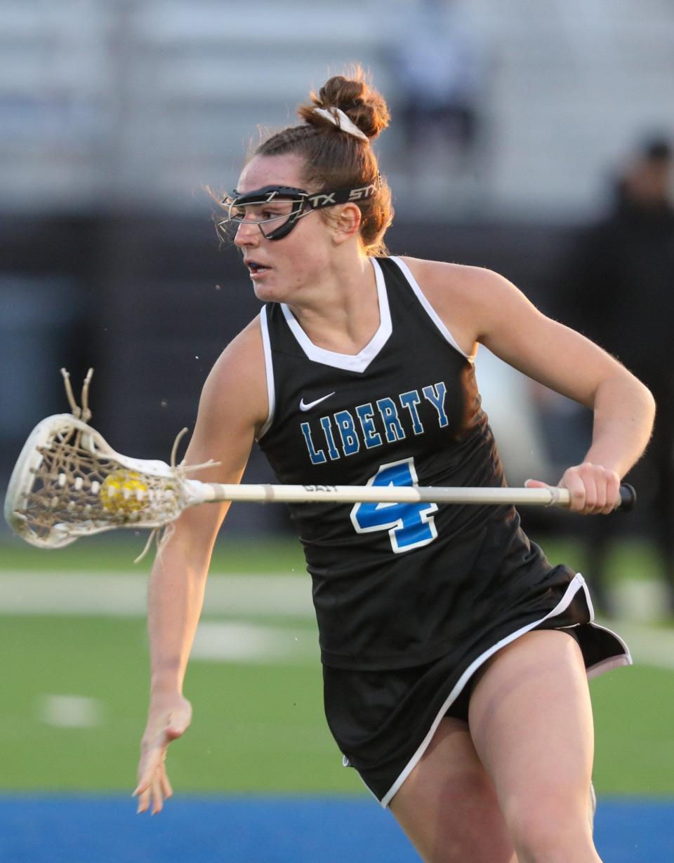 Olentangy Liberty junior Makena Harrington scored five goals, including the 100th of her prep career, to spark a 13-7 victory over Worthington Kilbourne on April 21.