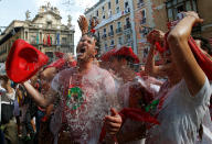 <p>Revellers are splashed with water before the opening of the San Fermin festival in Pamplona, Spain, July 6, 2018. (Photo: Joseba Etxaburu/Reuters) </p>