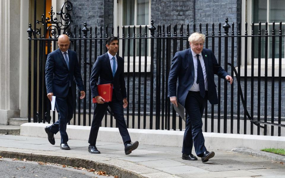 Sajid Javid, Rishi Sunak and Boris Johnson pictured in happer times last year - Leon Neal/Getty Images