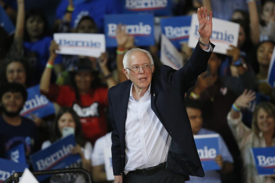 Democratic presidential candidate Sen. Bernie Sanders, I-Vt., waves to the crowd from the stage at a campaign rally Thursday, March 5, 2020, in Phoenix. (AP Photo/Ross D. Franklin)