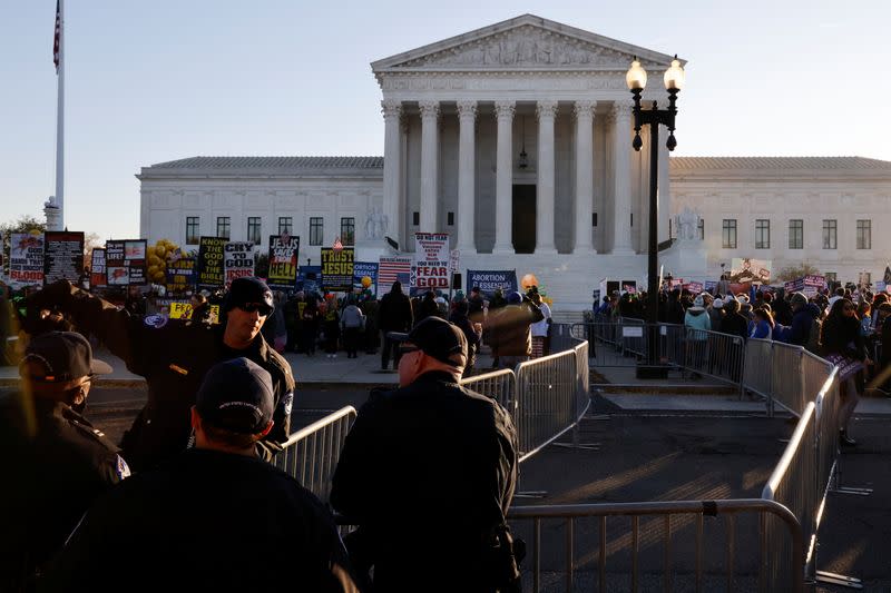 Anti-abortion and pro-abortion rights protesters gather outside Supreme Court in Washington