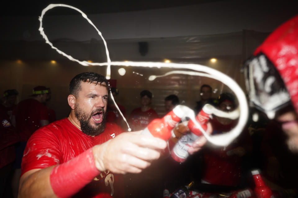 Philadelphia Phillies' Kyle Schwarber celebrates after winning a baseball game against the Pittsburgh Pirates to clinch a wild-card playoff spot, Tuesday, Sept. 26, 2023, in Philadelphia. (AP Photo/Matt Slocum)