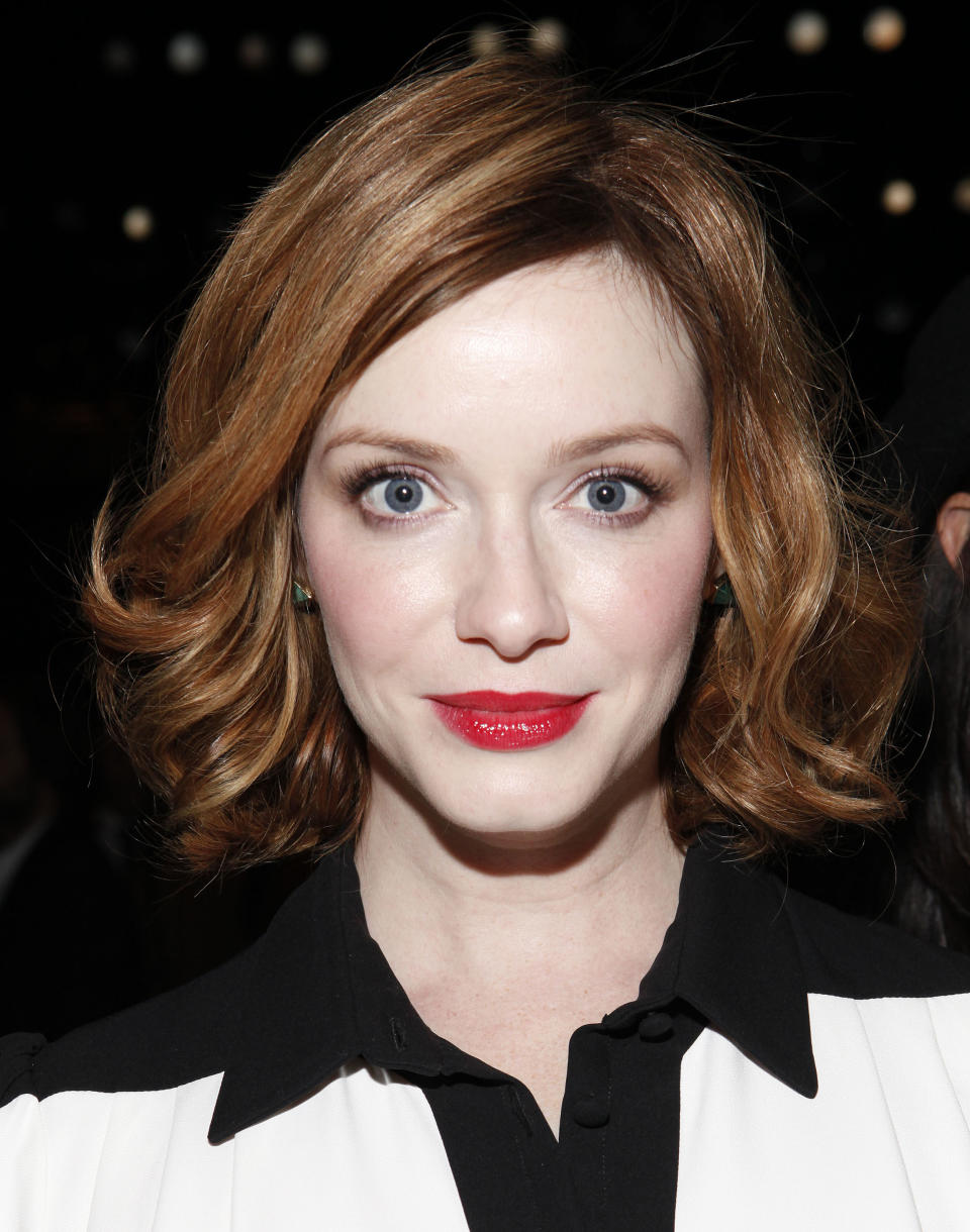 Christina Hendricks attends the Carolina Herrera collection on Monday, Sept. 9, 2013, during Mercedes-Benz Fashion Week in New York. (Photo by Amy Sussman/Invision/AP)