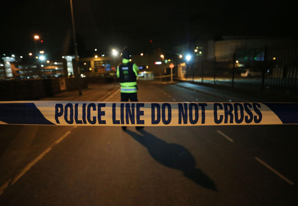 <p>British police guard the entrance to the Manchester Arena stadium in Manchester, United Kingdom on May 23, 2017. A large explosion was reported earlier in the evening and British police confirmed that at least 19 killed and many other wounded at American singer Ariana Grande concert at Manchester Arena. UK officials treating Manchester Arena explosion as possible terrorist incident. (Lindsey Parnaby/Anadolu Agency/Getty Images) </p>