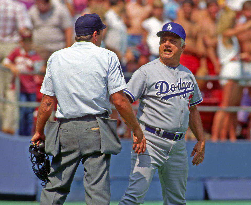 Manger Tommy Lasorda of the Los Angeles Dodgers argues with Major League Baseball umpire Ed Montague during a game against the Pittsburgh Pirates at Three Rivers Stadium circa 1987 in Pittsburgh, Pennsylvania. (Photo by George Gojkovich/Getty Images)