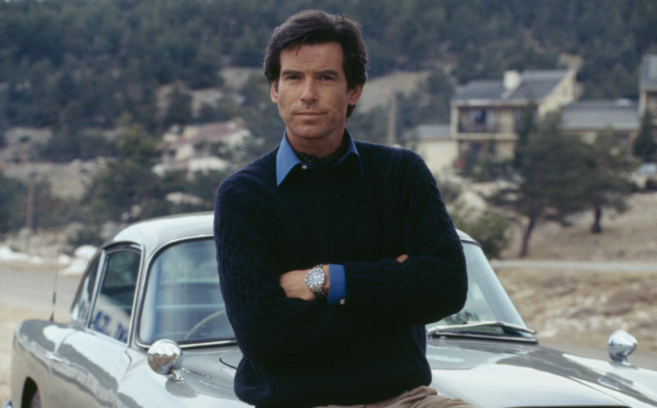 Pierce Brosnan poses against an Aston Martin DB5 in a publicity still for the James Bond film 'GoldenEye'. (Photo by Keith Hamshere/Getty Images)