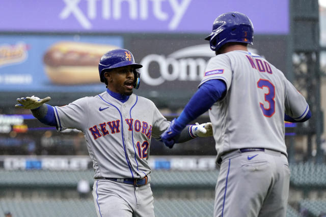 New York Mets' Francisco Lindor is greeted by Tomas Nido after hitting a two-run home run during the fifth inning in the first game of a baseball doubleheader against the Detroit Tigers, Wednesday, May 3, 2023, in Detroit. (AP Photo/Carlos Osorio)
