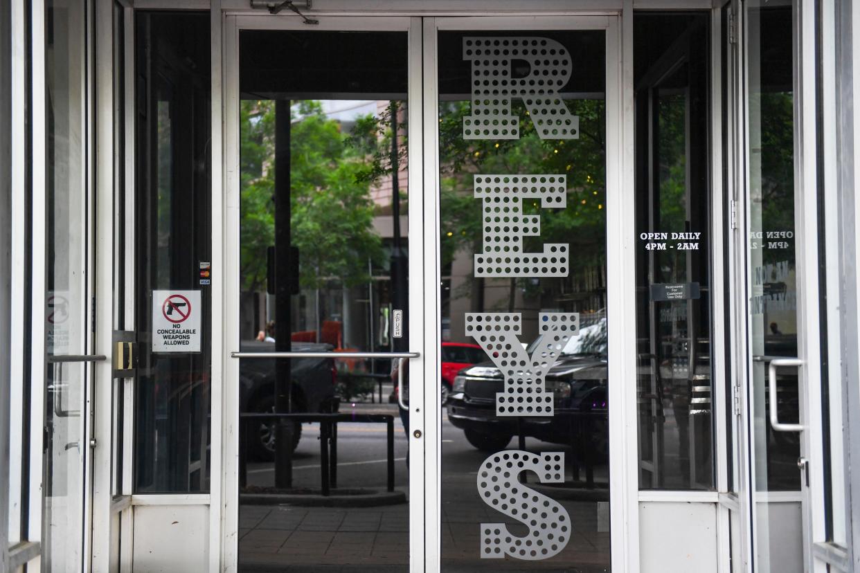 A "No concealable weapons" sign is visible in the doorway at Rey's in downtown Greenville on Friday, May 3, 2024.
