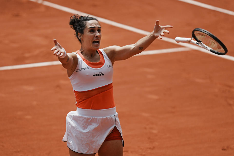 Italy's Martina Trevisan celebrates winning her quarterfinal match against Canada's Leylah Fernandez in three sets, 6-2, 6-7 (3-7), 6-3, at the French Open tennis tournament in Roland Garros stadium in Paris, France, Tuesday, May 31, 2022. (AP Photo/Thibault Camus)