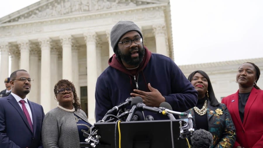 Evan Milligan (center), plaintiff in Merrill v. Milligan, an Alabama redistricting case, speaks with reporters following oral arguments at the Supreme Court in Washington on Thursday. (Photo: Patrick Semansky/AP, File)