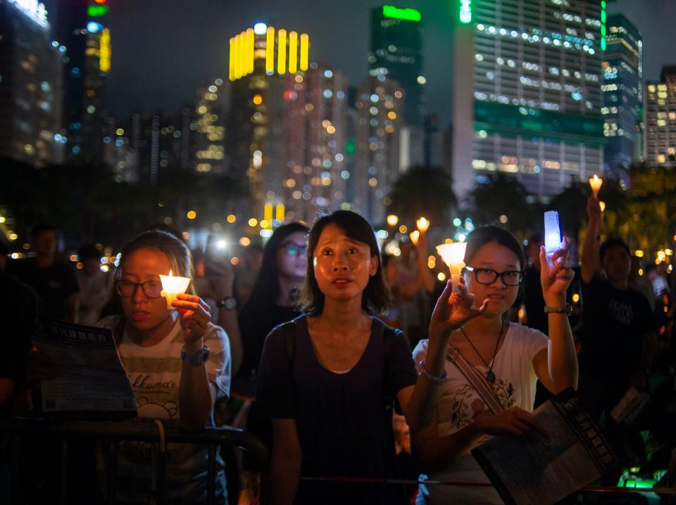 china hong kong tiananmen square protest vigil People are seen holding Candle lights is seen during a vigil in Hong Kong, China. 4 June 2019. Thousands of People Participated in an annual Candlelight vigil in Victoria Park to commemorate the protesters killed in Beijing's Tiananmen Square in 1989. (Photo by Vernon Yuen/NurPhoto via Getty Images)