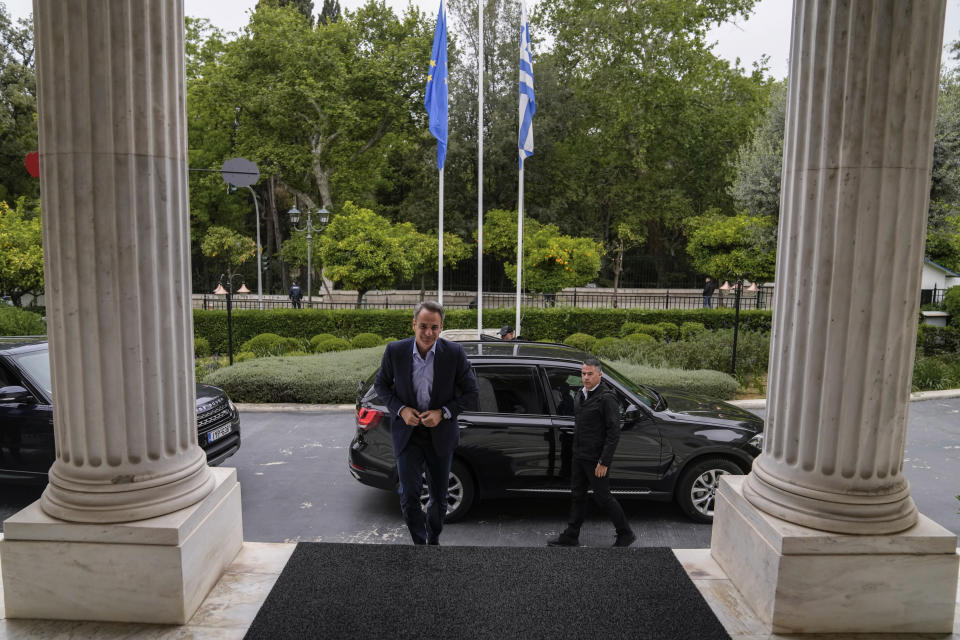 Greece's Prime Minister and New Democracy leader Kyriakos Mitsotakis arrives at his office in Maximos Mansion during the election campaign in Athens, Greece, Tuesday, May 9, 2023. (AP Photo/Thanassis Stavrakis)