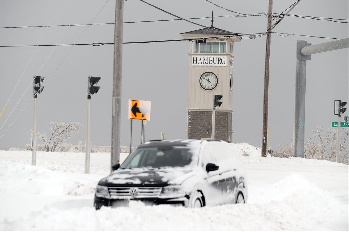  Ice and snow cover an abandoned vehicle along the Lake Erie shoreline (Getty Images)