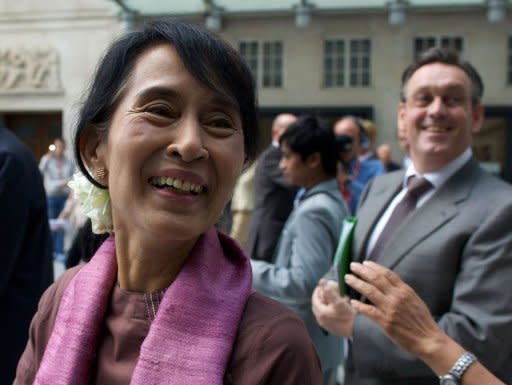 Myanmar democracy icon Aung San Suu Kyi leaves after meeting staff at BBC Broadcasting House in central London. Suu Kyi began a bittersweet return to Britain on Tuesday during which she will be showered with honours and have an emotional family reunion after nearly a quarter of a century in Myanmar