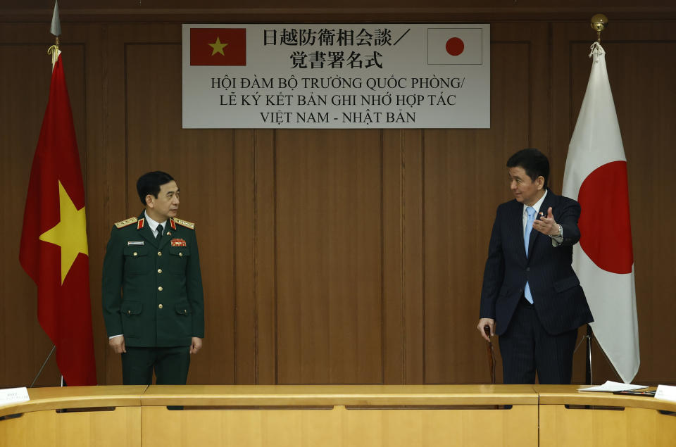 Vietnam's Defense Minister General Phan Van Giang, left, meets with Japan's Defense Minister Nobuo Kishi at the Defense Ministry in Tokyo, Tuesday, Nov. 23, 2021. (Issei Kato/Pool Photo via AP)