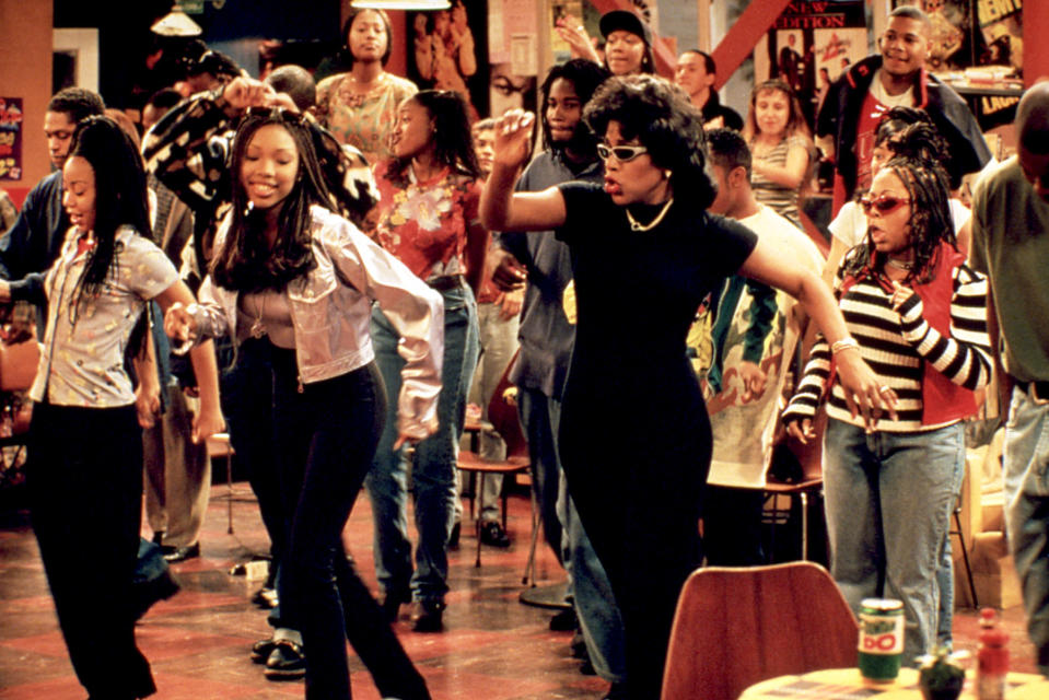 A still of Brandy Norwood as Moesha Mitchell, Sheryl Lee Ralph as Dee Mitchell, and Countess Vaughn as Kim Parker dancing on the set of Moesha