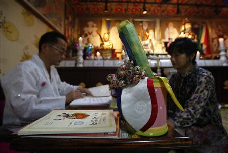 Various tools are seen as shaman Choi Kuing-hun foresees a child's future at his house in Seongnam, south of Seoul, August 16, 2013. REUTERS/Kim Hong-Ji