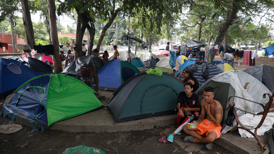 <sup>Migrants mostly from Venezuela and Cuba rest in a tent camp as they wait for a Honduras Migration transit permit to continue their way north to Guatemala, and hopefully make it to the Mexico-United States border, in Danlí, Honduras on Oct. 11, 2023. (Elmer Martinez, Associated Press)</sup>