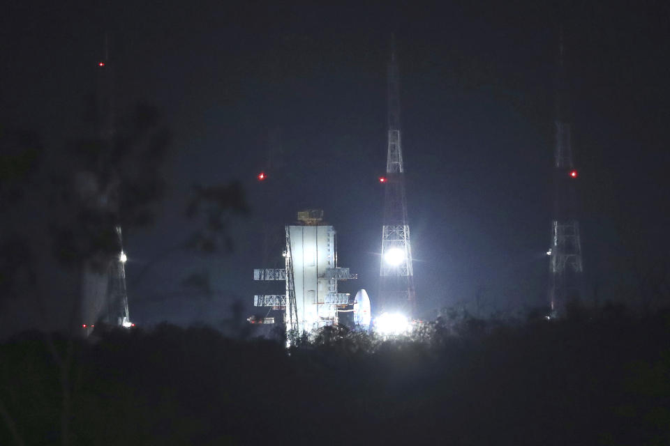 Indian Space Research Organization (ISRO)'s Geosynchronous Satellite launch Vehicle (GSLV) MkIII carrying Chandrayaan-2 stands at Satish Dhawan Space Center after the mission was aborted at Sriharikota in southern India, Monday, July 15, 2019. India has called off the launch of a moon mission to explore the lunar south pole. The Chandrayaan-2 mission was aborted less than an hour before takeoff on Monday. An Indian Space Research Organization spokesman says a "technical snag" was observed in the 640-ton launch-vehicle system. (AP Photo/Manish Swarup)