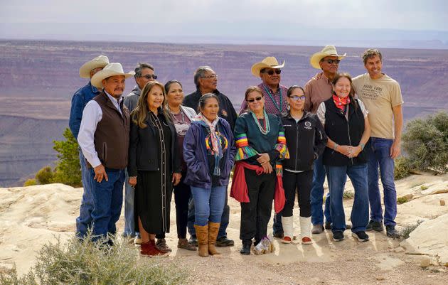 Board members, staff and supporters of the Indigenous-led group Utah Diné Bikéyah celebrate President Joe Biden's decision to restore the boundaries of Bears Ears National Monument at an overlook on Cedar Mesa in San Juan County on Oct. 8, 2021, in Utah. (Photo: via Associated Press)