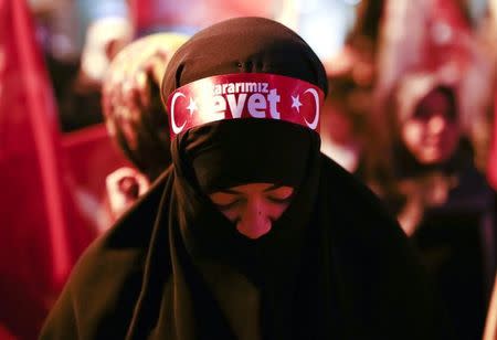 A supporters of Turkish President Tayyip Erdogan attends a support rally at the AK party headquarters in Istanbul, Turkey, April 16, 2017. REUTERS/Alkis Konstantinidis