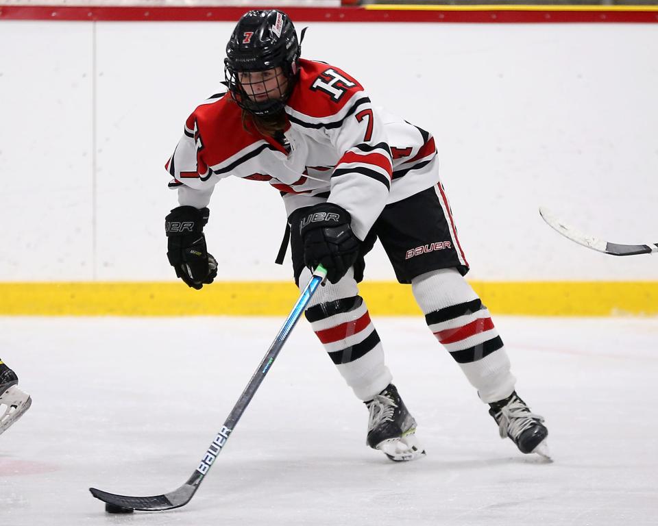 Hingham’s Caroline Doherty pounces on the puck and goes on the attack during third period action of their game against Pembroke at Pilgrim Arena on Saturday, Feb. 18, 2023.