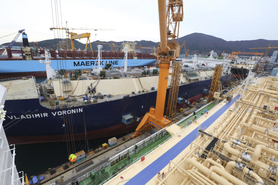 In this Friday, Dec. 7, 2018 photo, construction continues on large-sized liquefied natural gas (LNG) carriers at the Daewoo Shipbuilding and Marine Engineering facility in Geoje Island, South Korea. More than half of the 35 vessels scheduled for delivery in 2018 were LNG carriers. A similar number of vessels are lined up for completion in 2019. (AP Photo/Ahn Young-joon)