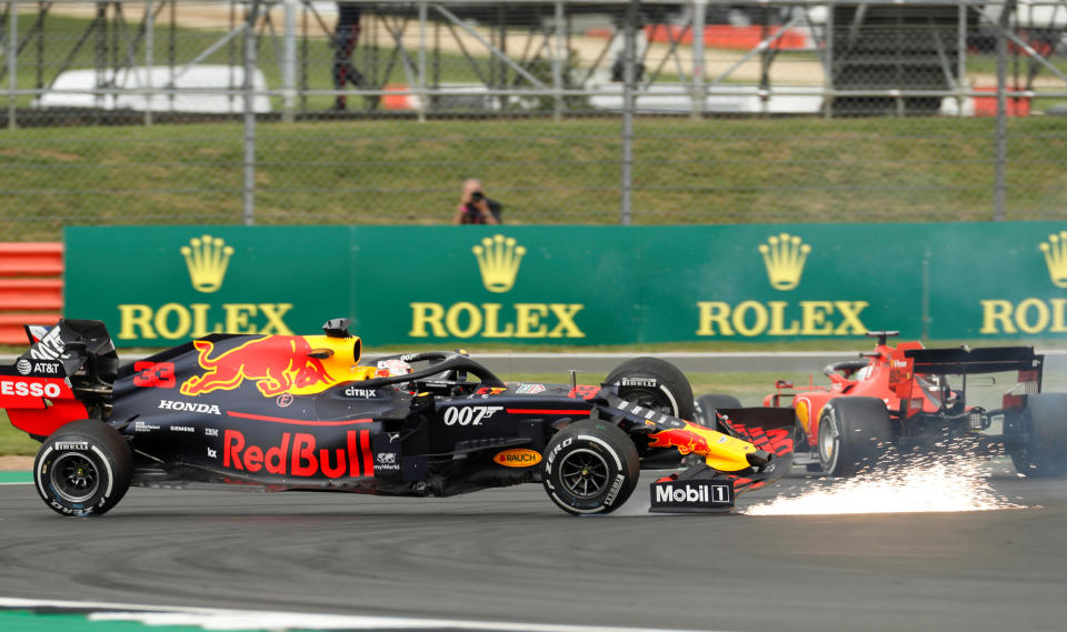 Formula One F1 - British Grand Prix - Silverstone Circuit, Silverstone, Britain - July 14, 2019   Red Bull's Max Verstappen and Ferrari's Sebastian Vettel crash during the race   REUTERS/John Sibley