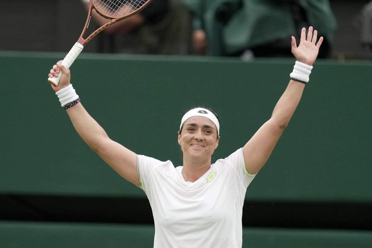 Tunisia's Ons Jabeur celebrates winning against Aryna Sabalenka of Belarus during their women's semifinal singles match on day eleven of the Wimbledon tennis championships in London, Thursday, July 13, 2023. (AP Photo/Kin Cheung)