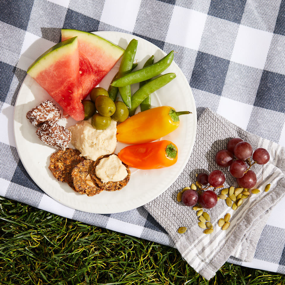 <p>Fresh veggies with dip, juicy fruit and even a sweet treat make up this easy-to-make picnic dinner that's great for packing up or enjoying at home. Plus, this combo excludes the most common allergens and food intolerances (it's free from dairy, eggs, soy, nuts and gluten) so just about everyone should be able to enjoy it without worrying. <a href="https://www.eatingwell.com/recipe/264493/sweet-savory-hummus-plate/" rel="nofollow noopener" target="_blank" data-ylk="slk:View Recipe;elm:context_link;itc:0;sec:content-canvas" class="link ">View Recipe</a></p>