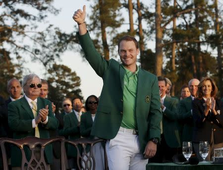 Apr 10, 2016; Augusta, GA, USA; Danny Willett celebrates in the green jacket after winning the 2016 The Masters golf tournament at Augusta National Golf Club. Mandatory Credit: Rob Schumacher-USA TODAY Sports