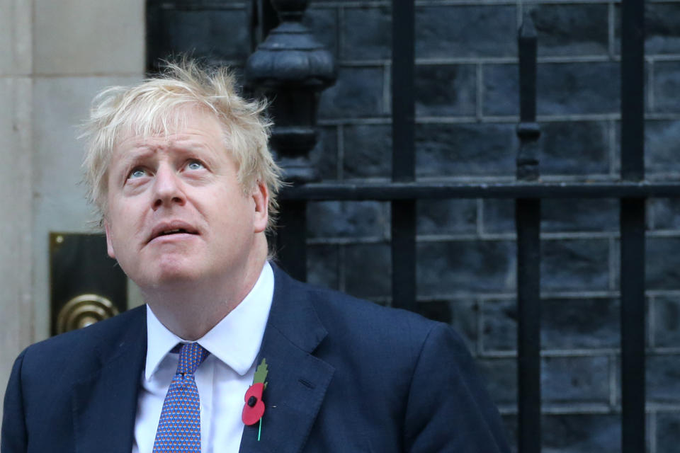 Britain's Prime Minister Boris Johnson looks up as he meets with fundraisers for the Royal British Legion outside 10 Downing street in central London on October 28, 2019. - European Union members agreed today to postpone Brexit for up to three months, stepping in with their decision less than 90 hours before Britain was due to crash out with no divorce deal. (Photo by ISABEL INFANTES / AFP) (Photo by ISABEL INFANTES/AFP via Getty Images)