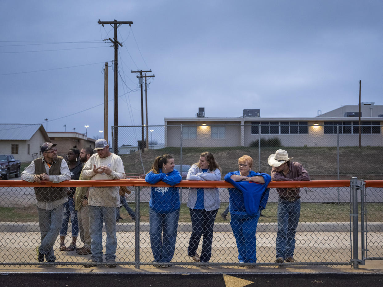 Spectators watch a track and field event during a middle school track meet at Robert Lee ISD in Robert Lee, Texas on March 9, 2023. (Matthew Busch for NBC News)