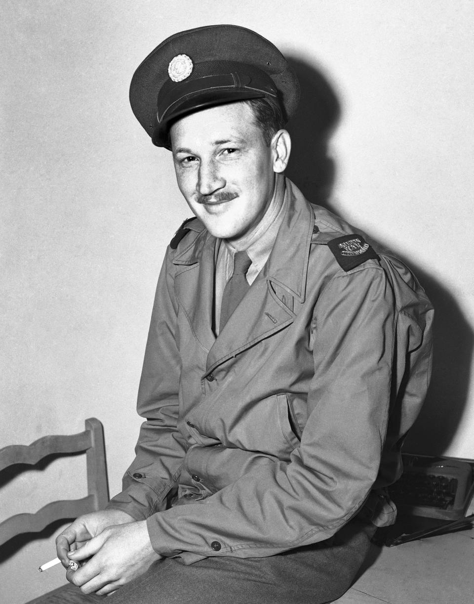 FILE - Associated Press correspondent Don Whitehead is shown, March 8, 1943. On D-Day, The Associated Press had reporters, artists and photographers in the air, on the choppy waters of the English Channel, in London, and at English departure ports and airfields to cover the Allied assault in Normandy, France. (AP Photo/Herbert K. White, File)