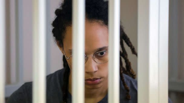 PHOTO: Brittney Griner sits inside a defendants' cage during the reading of the court's verdict in Khimki, Russia, Aug. 4, 2022. (Evgenia Novozhenina/Reuters)