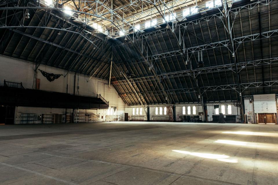 The Cranston Street Armory's empty drill hall. In the short term, the Armory will be a warming center for the homeless, but the state has hired a company to come up with a reuse plan for the historic building.