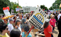 Demonstrators march down Pennsylvania Avenue past the White House during a People's Climate March, to protest U.S. President Donald Trump's stance on the environment, in Washington, U.S., April 29, 2017. REUTERS/Mike Theiler