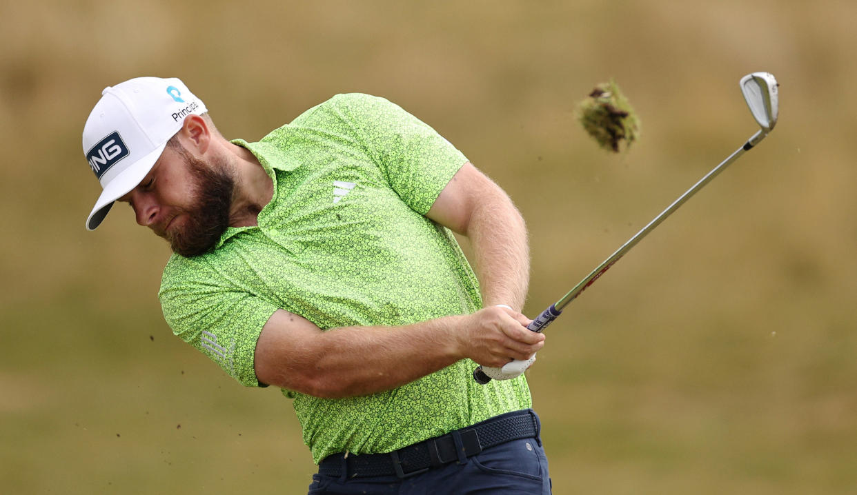  Tyrrell Hatton strikes his iron shot 