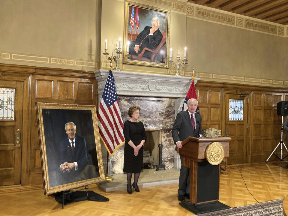 Gov. Asa Hutchinson speaks to reporters at the state Capitol in Little Rock, Ark. on Tuesday, Jan. 3, 2023, after his official portrait was unveiled. (AP Photo/Andrew DeMillo)