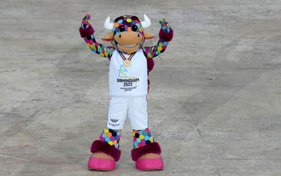 The Commonwealth Games mascot Perry the Bull entertains the crowd during the pre show - AP